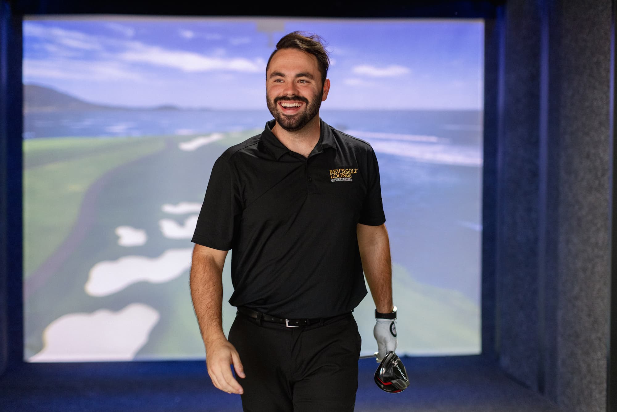 Full Swing simulator bay inside Rev's Golf Lounge — the same setup we bring to your event